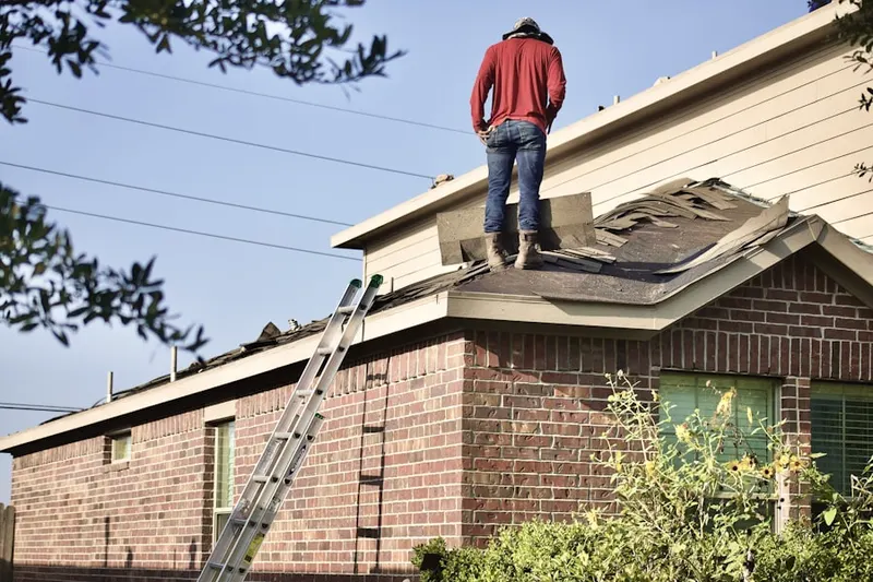 Professional roofer working on a residential roof in Hagerstown